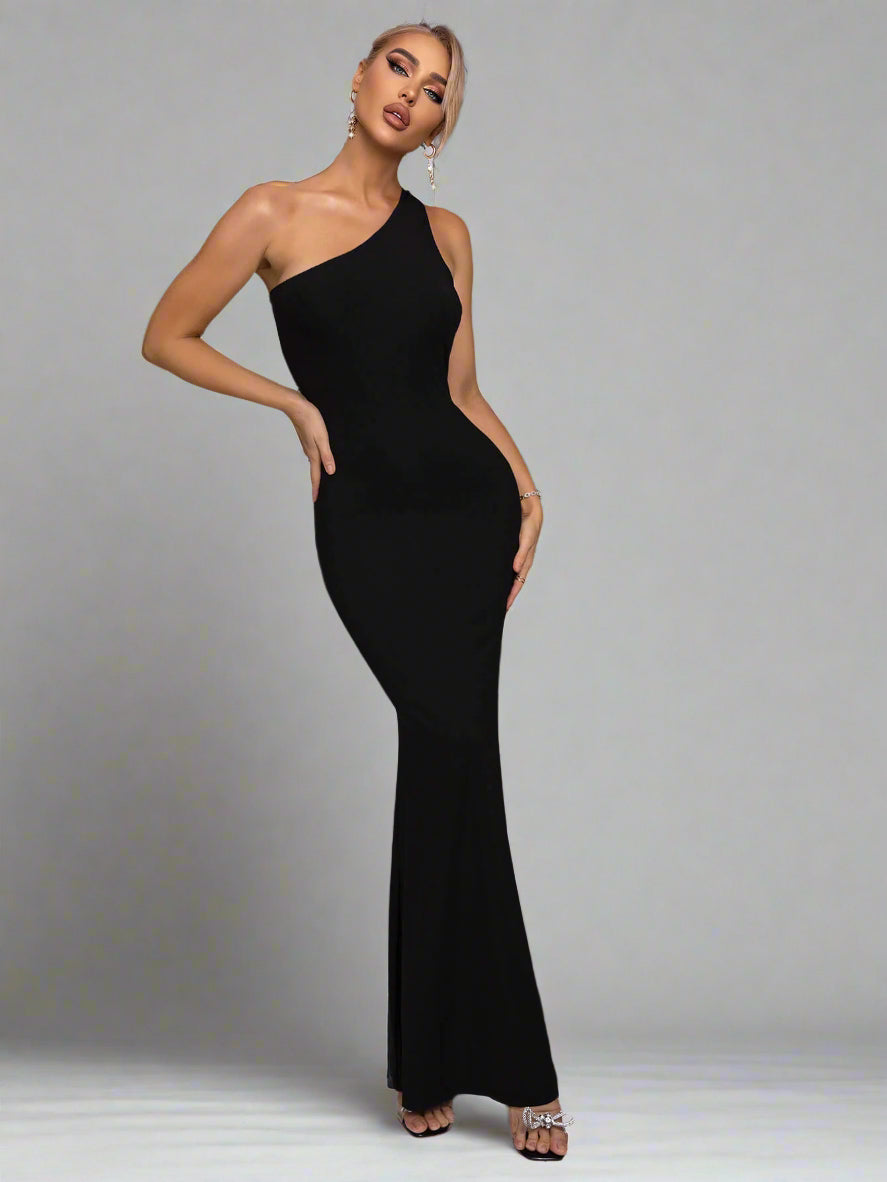 A woman wearing Cutout One-Shoulder Maxi Dress