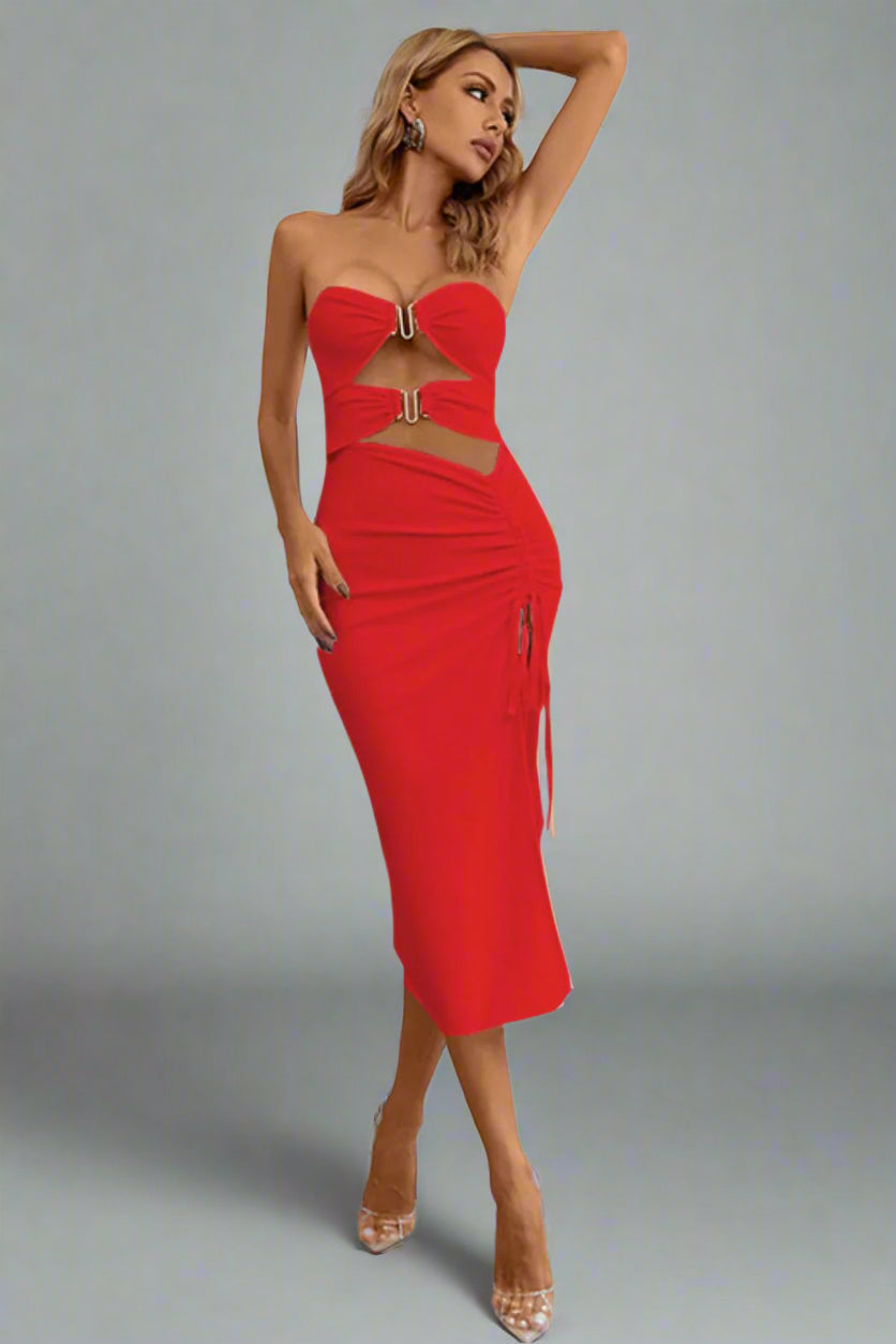 A woman is wearing The Bare Intentions Bandage Dress