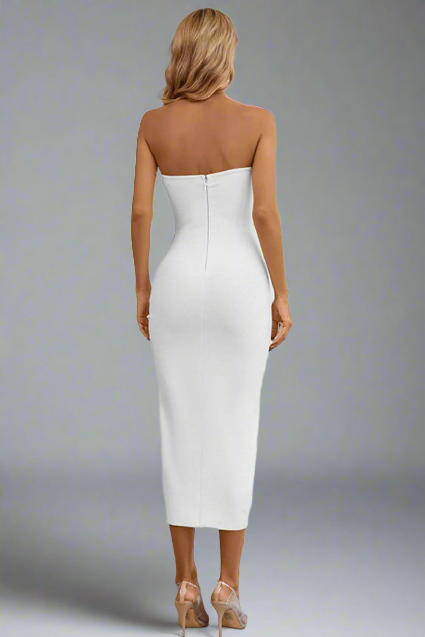 A woman is wearing The Bare Intentions Bandage Dress White