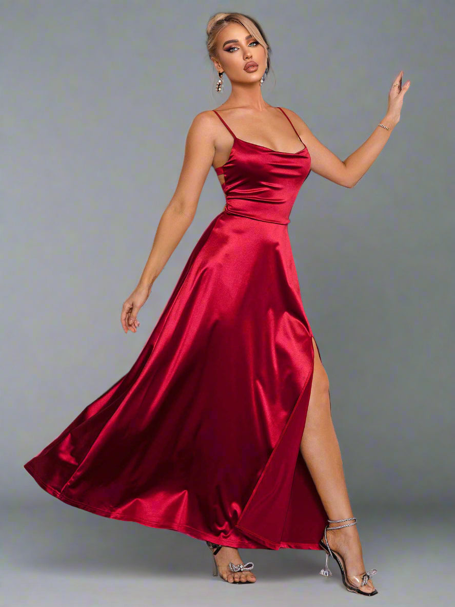 a woman is wearing a The Velvet Vow Dress in Merlot Satin