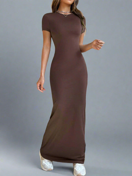 A woman is wearing Time For Spring Short Sleeve Maxi Tee Dress