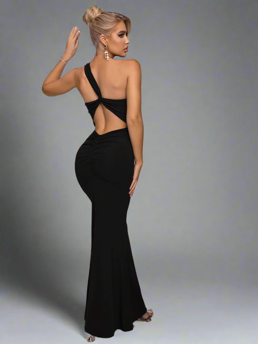 A woman wearing Cutout One-Shoulder Maxi Dress