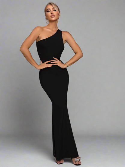 A woman wearing Cutout One-Shoulder Maxi Dress

