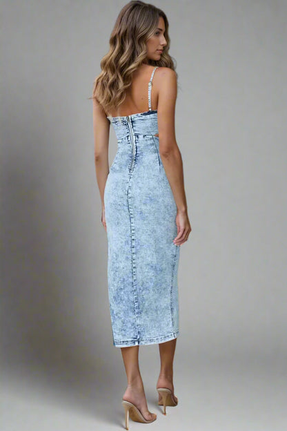 A woman is wearing Cutout Slit Spaghetti Strap Denim Dress
