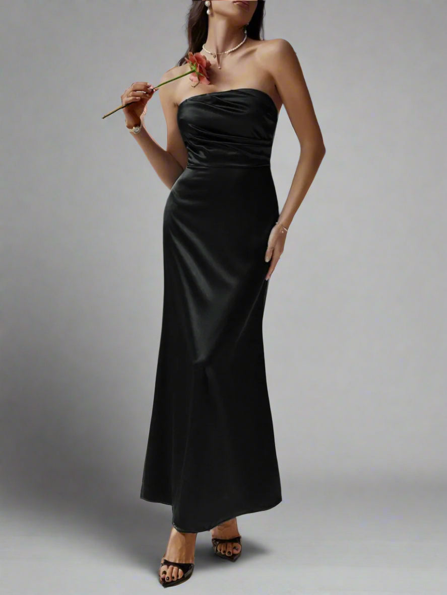 A woman is wearing Devine Ruched Tube Maxi Dress
