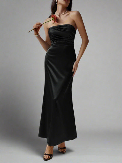 A woman is wearing Devine Ruched Tube Maxi Dress
