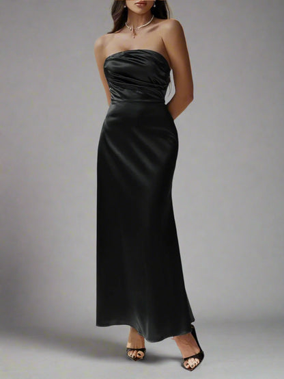 A woman is wesring Devine Ruched Tube Maxi Dress
