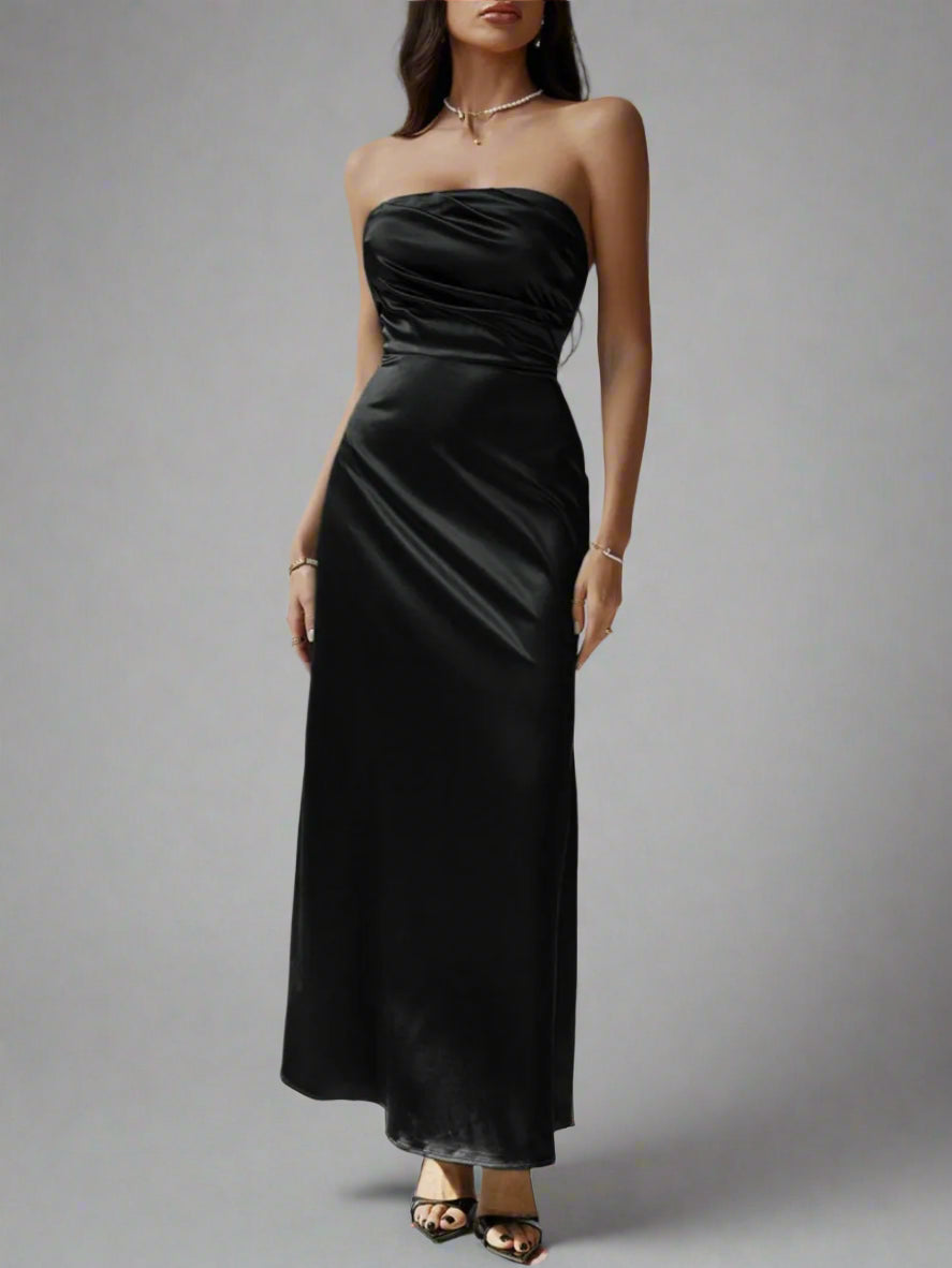 A woman is wearing Devine Ruched Tube Maxi Dress
