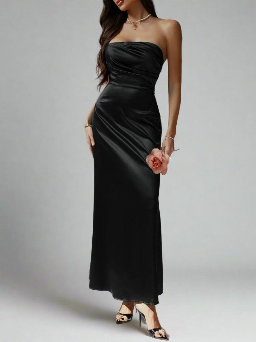 A woman is wearing Devine Ruched Tube Maxi Dress
