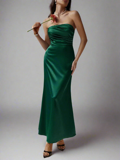 A woman is wearimg Devine Ruched Tube Maxi Dress
