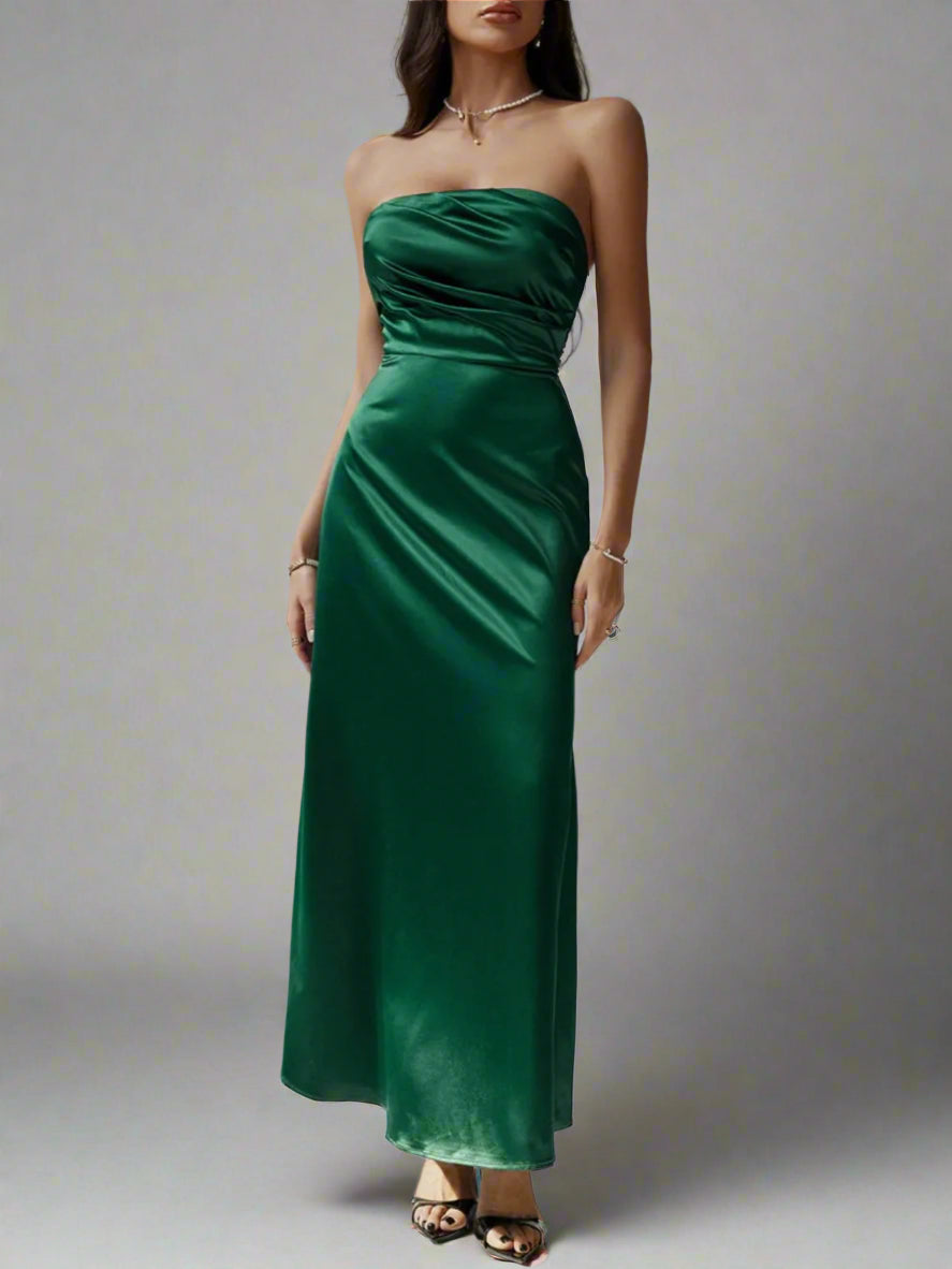 A woman is wearing Devine Ruched Tube Maxi Dress

