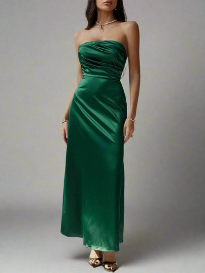 A woman is wearing Devine Ruched Tube Maxi Dress
