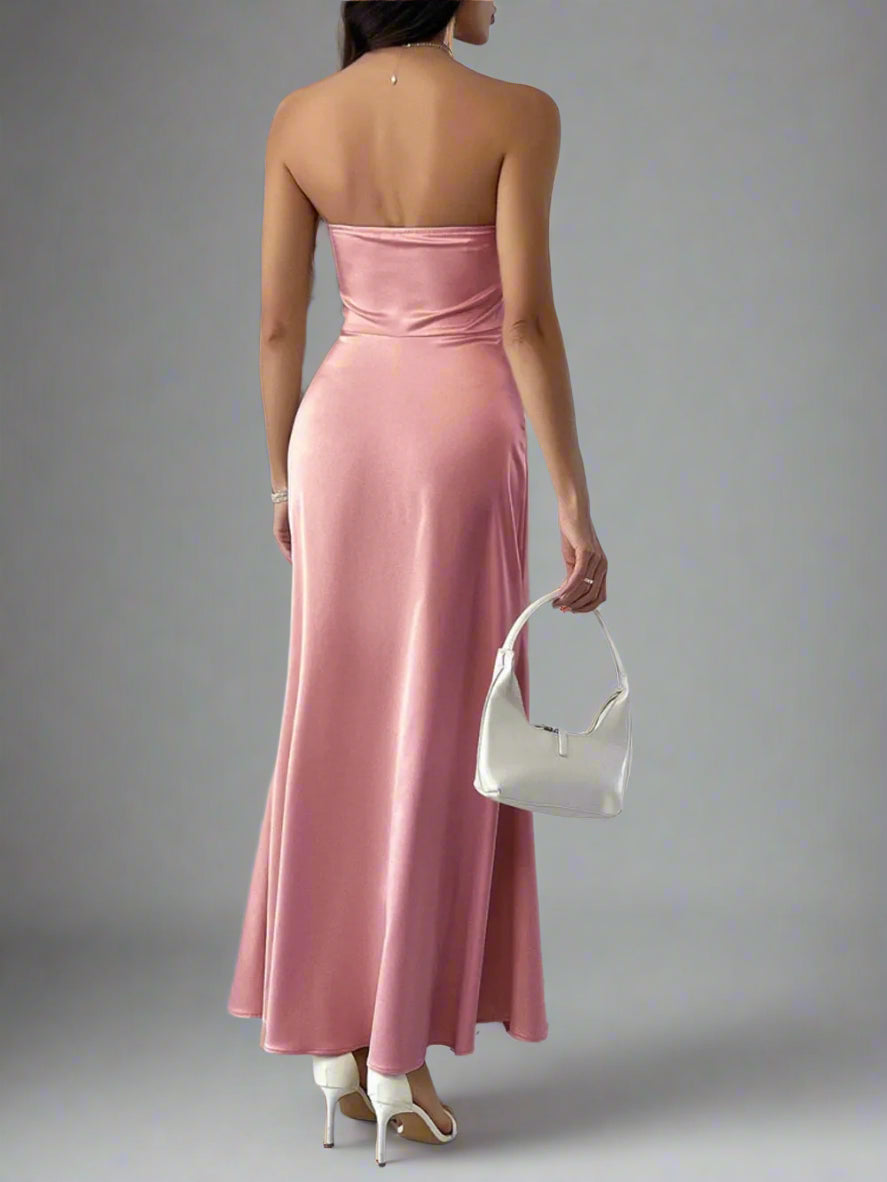 A woman is wearing Devine Ruched Tube Maxi Dress
