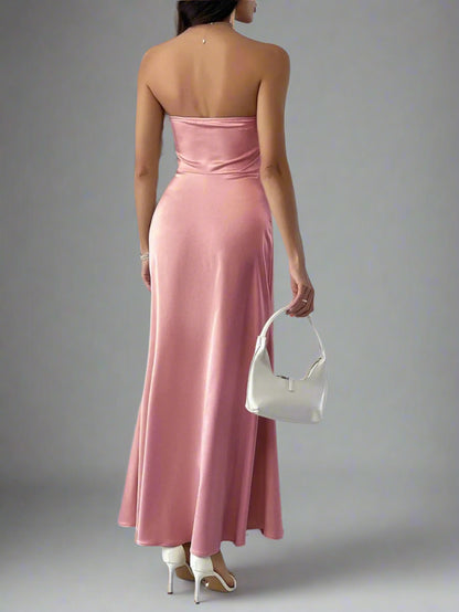 A woman is wearing Devine Ruched Tube Maxi Dress
