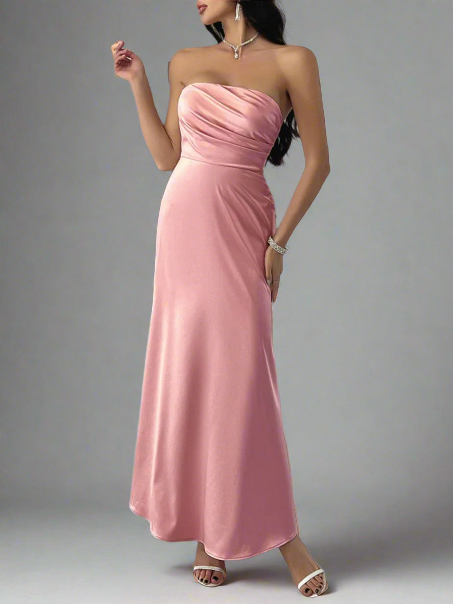 A woman is wearing Devine Ruched Tube Maxi Dress
