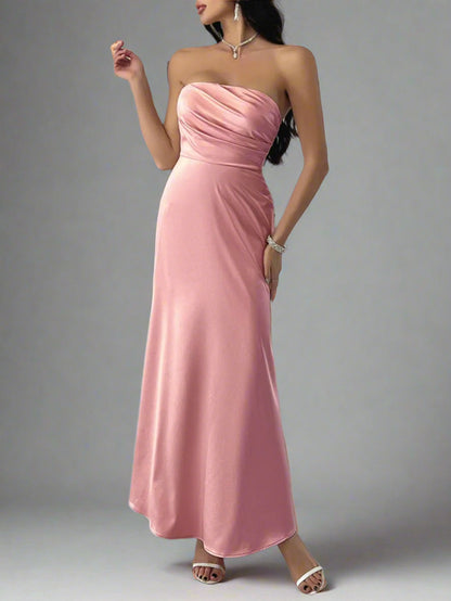 A woman is wearing Devine Ruched Tube Maxi Dress
