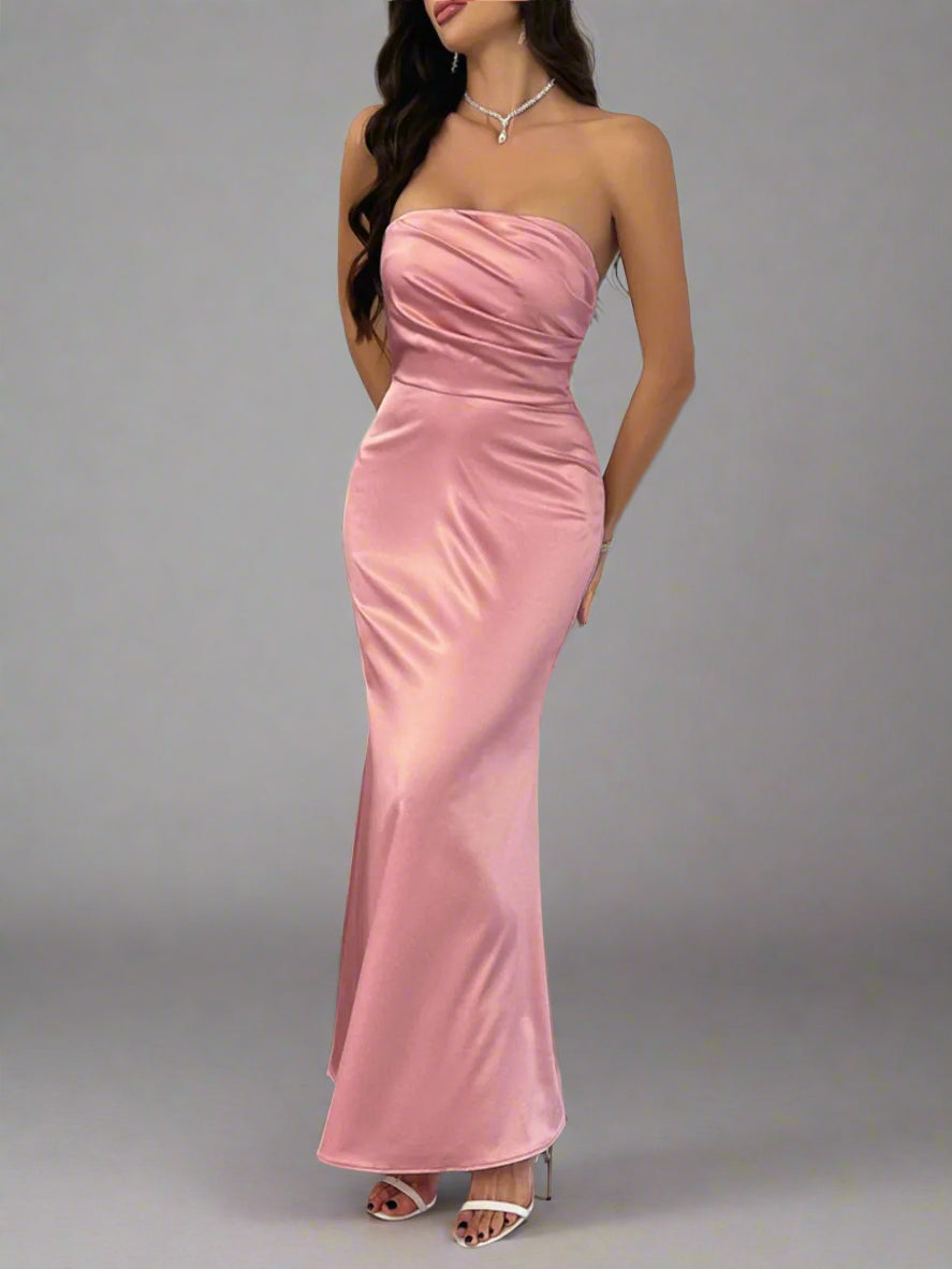 A woman is wearing Devine Ruched Tube Maxi Dress
