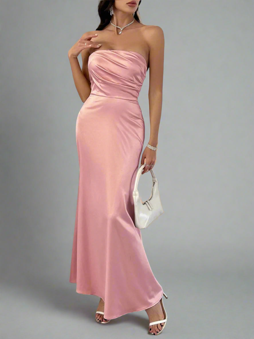 A woman is wearing Devine Ruched Tube Maxi Dress
