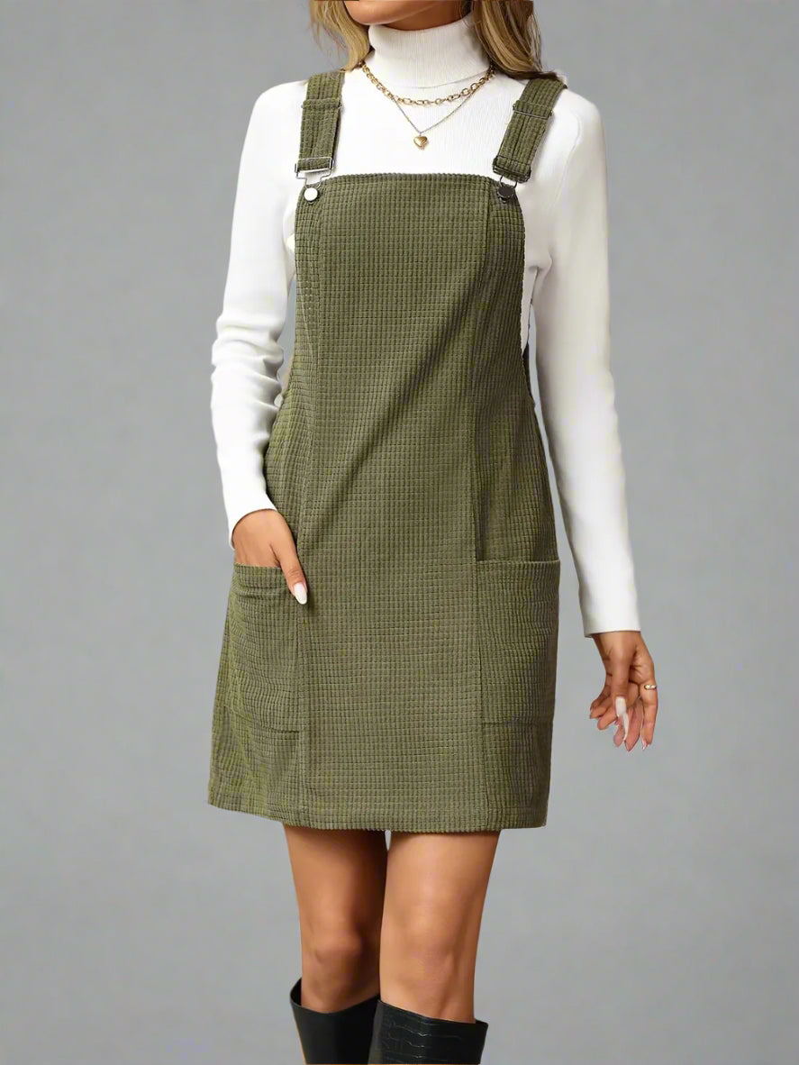 a woman is wearing Texture Sleeveless Mini Dress with Pockets
