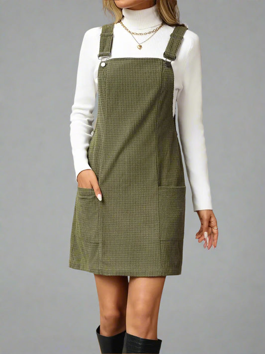 a woman is wearing Texture Sleeveless Mini Dress with Pockets
