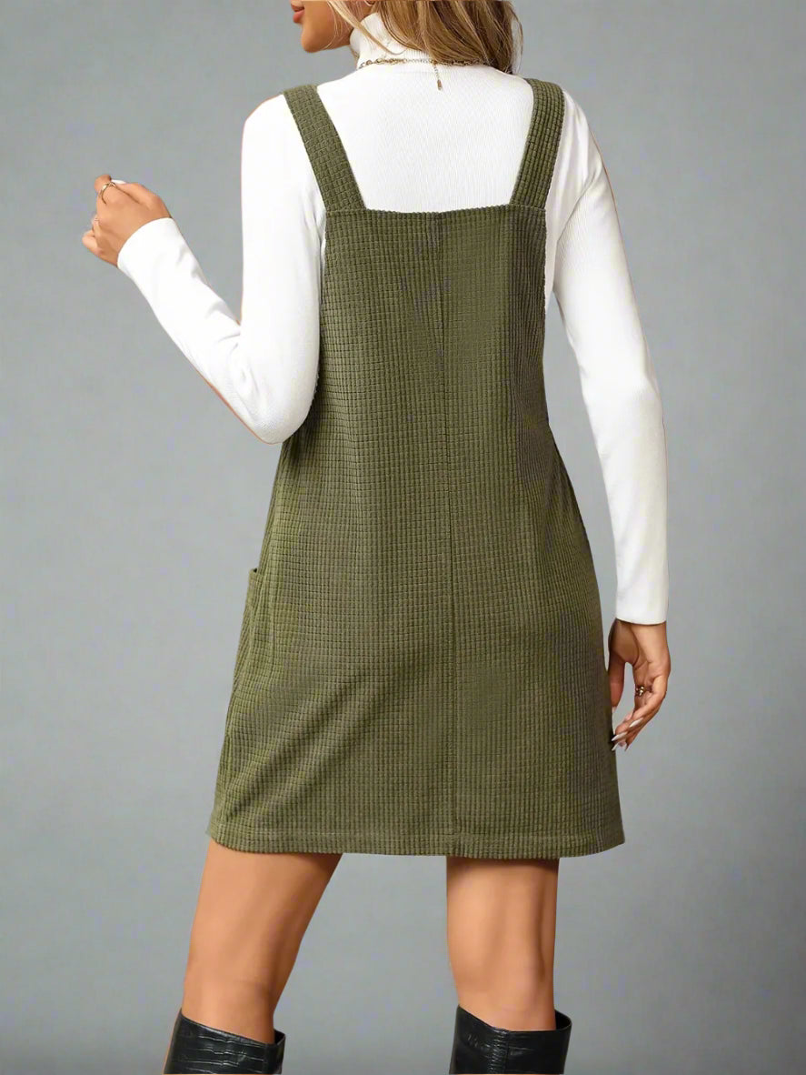 a woman is wearing Texture Sleeveless Mini Dress with Pockets
