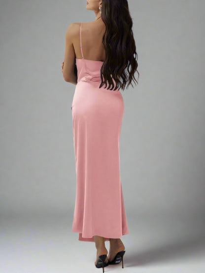 A woman is wearing The Goddess Motion Dress
