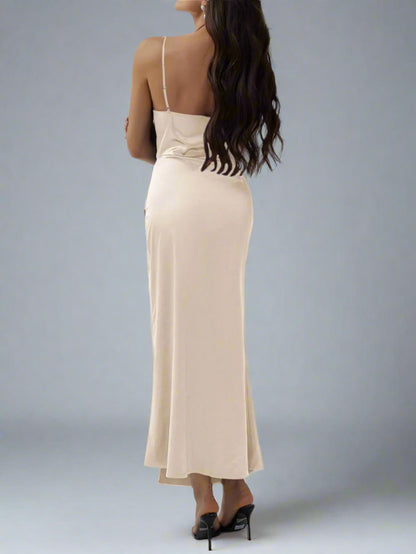 A woman is wearing The Goddess Motion Dress