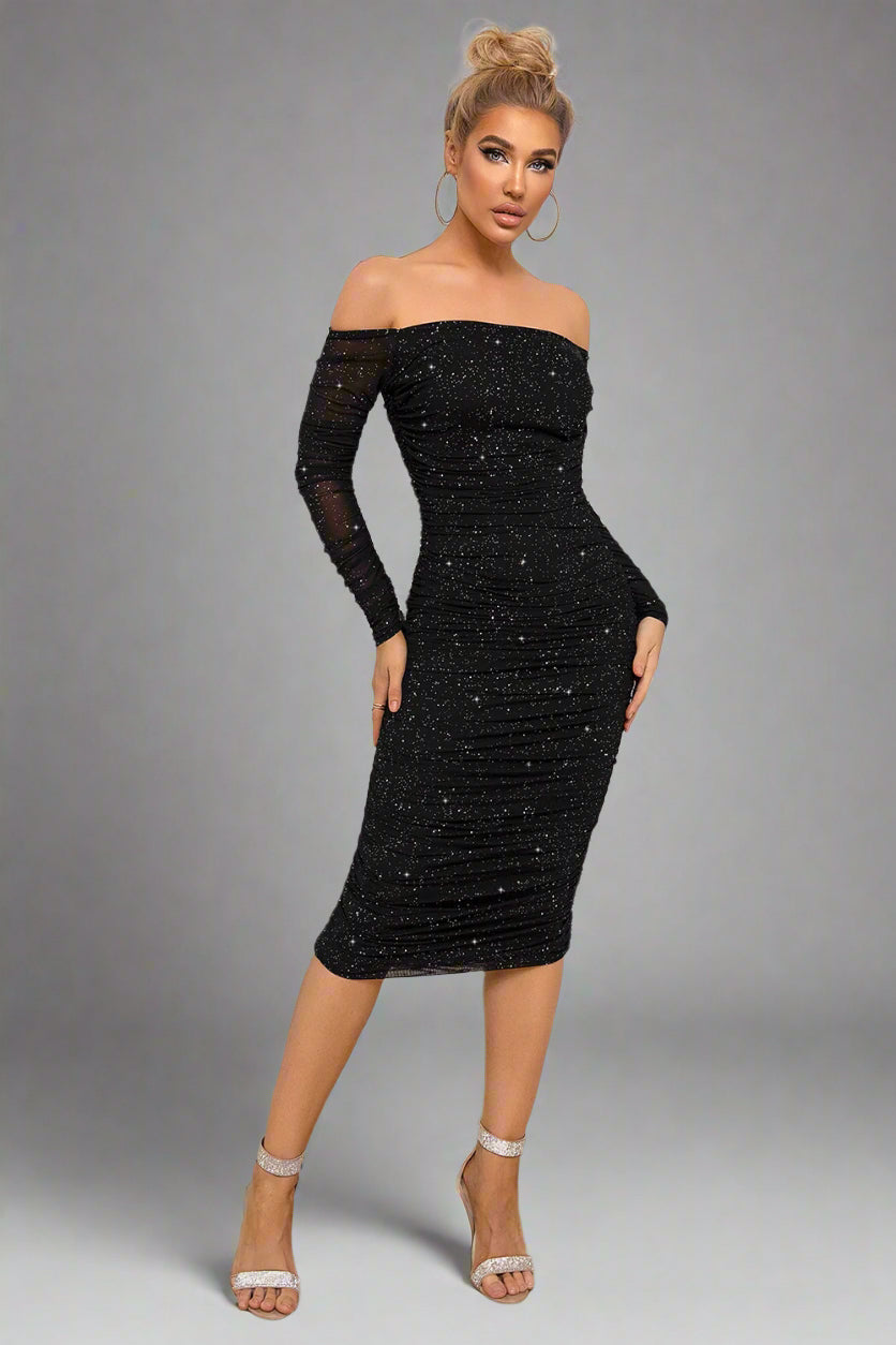 a woman is wearing a The Off-Shoulder Obsession Long Sleeve Ruched Dress

