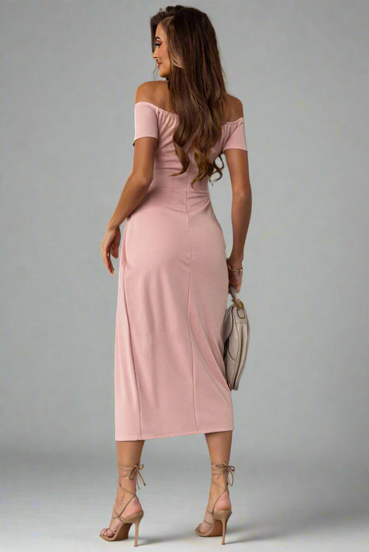 A woman is wearing a The Soft Serve Midi Off-Shoulder Split Dress
