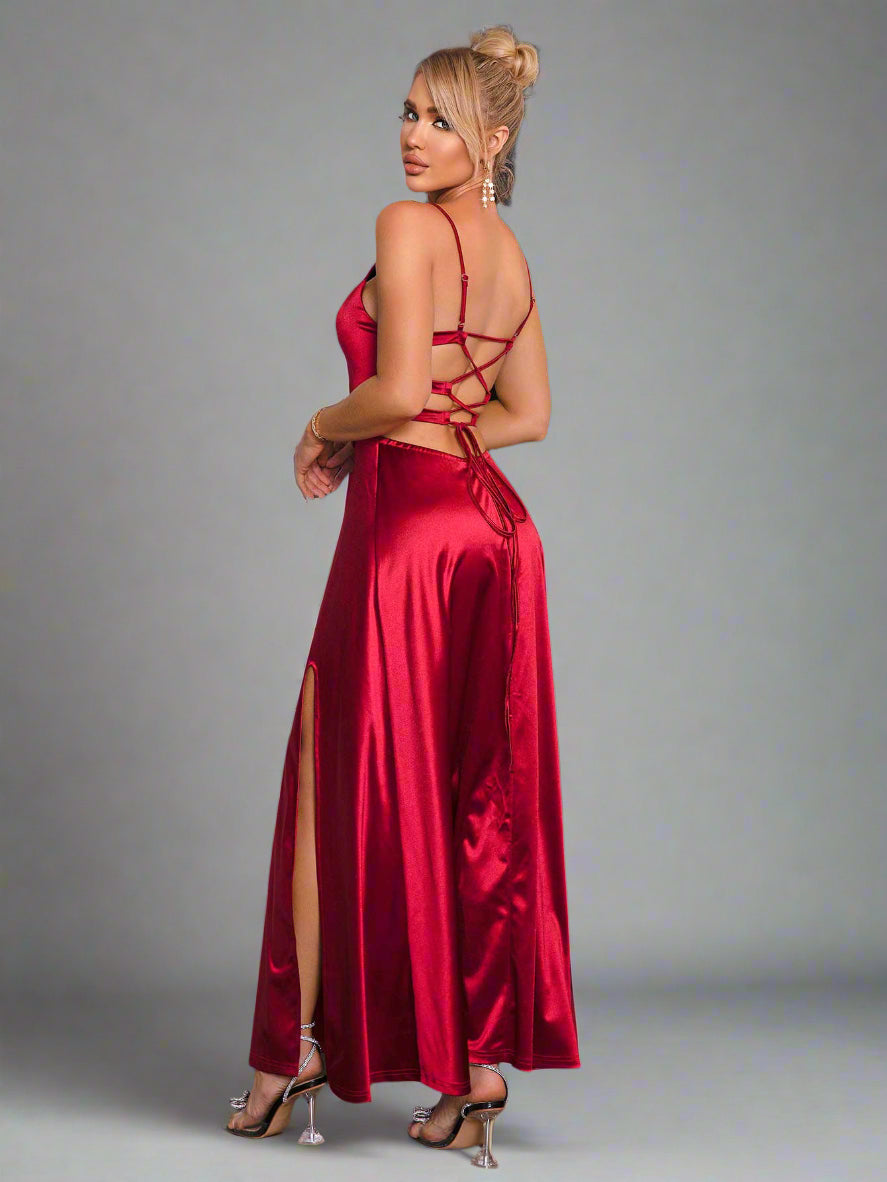 a woman is wearing a The Velvet Vow Dress in Merlot Satin
