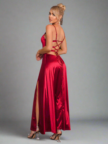 a woman is wearing a The Velvet Vow Dress in Merlot Satin
