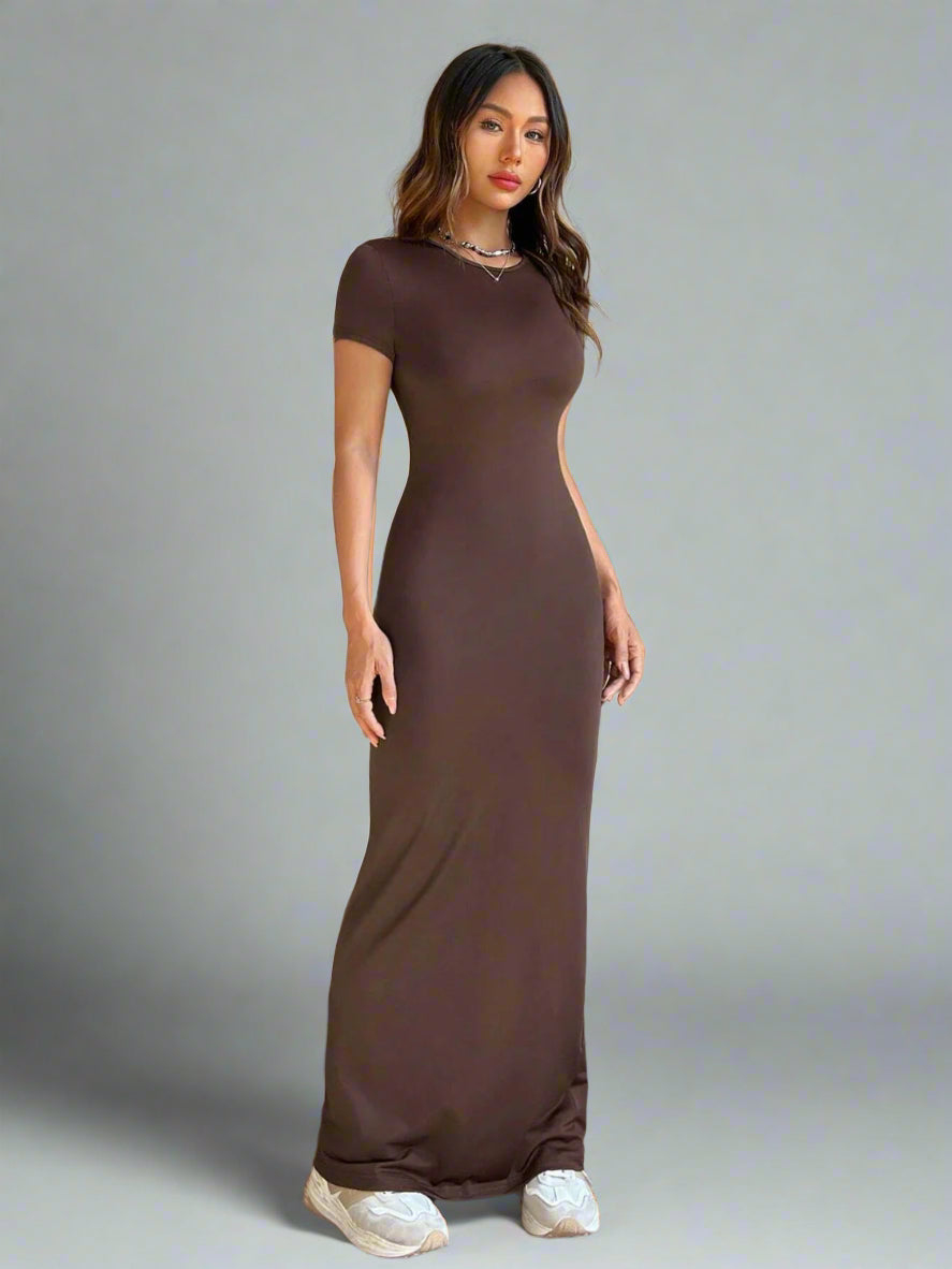 A woman is wearing Time For Spring Short Sleeve Maxi Tee Dress
