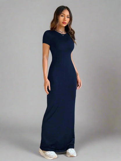 A woman is wearing Time For Spring Short Sleeve Maxi Tee Dress
